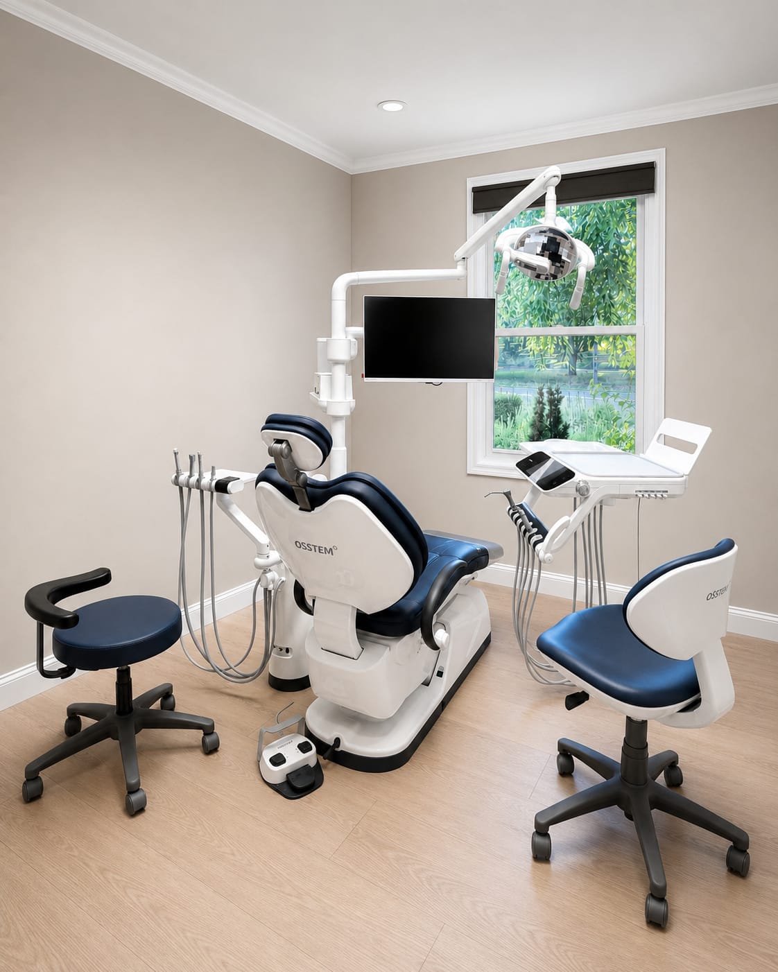 A treatment room with a navy Osstem dental chair, overhead light and monitor arm beside a bright window.